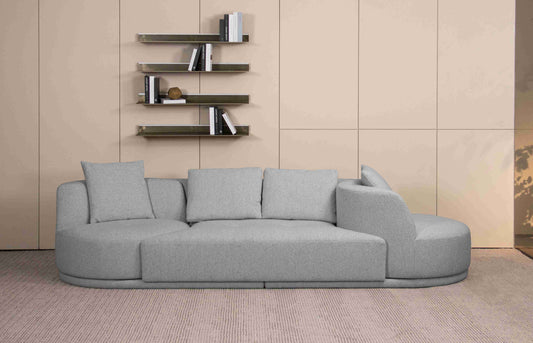 Canapé design fixe avec deux fauteuils pivotants à 360 degrés, forme arrondie et assise profonde, style contemporain avec coussins confortables