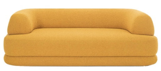 Canapé design moderne en tissu bouclé beige, aux formes arrondies et minimalistes,