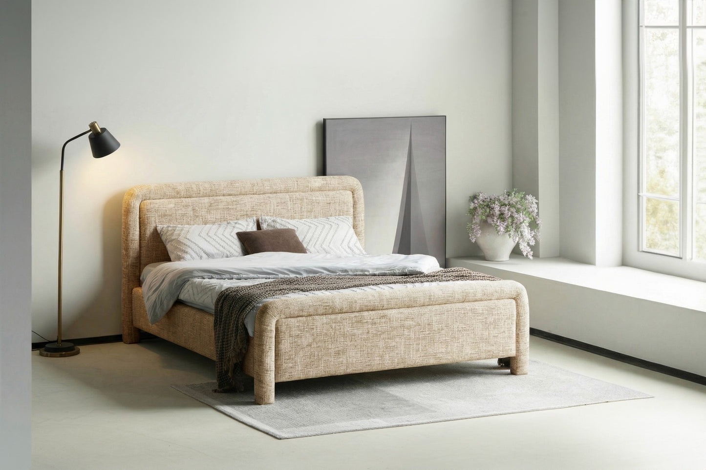 Tête de lit rembourrée au design moderne et arrondi, idéale pour une chambre élégante et chaleureuse.