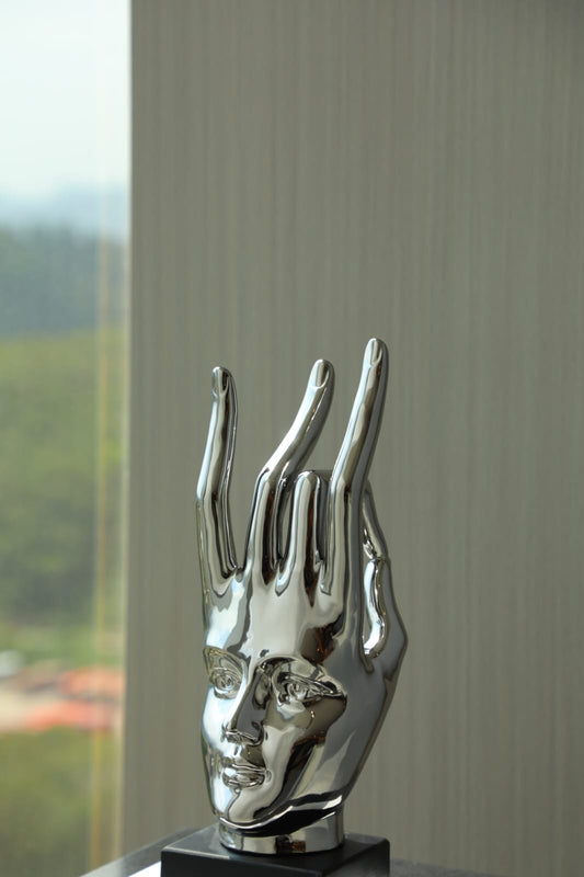 Sculpture visage abstrait chromé design moderne décoration intérieure luxe