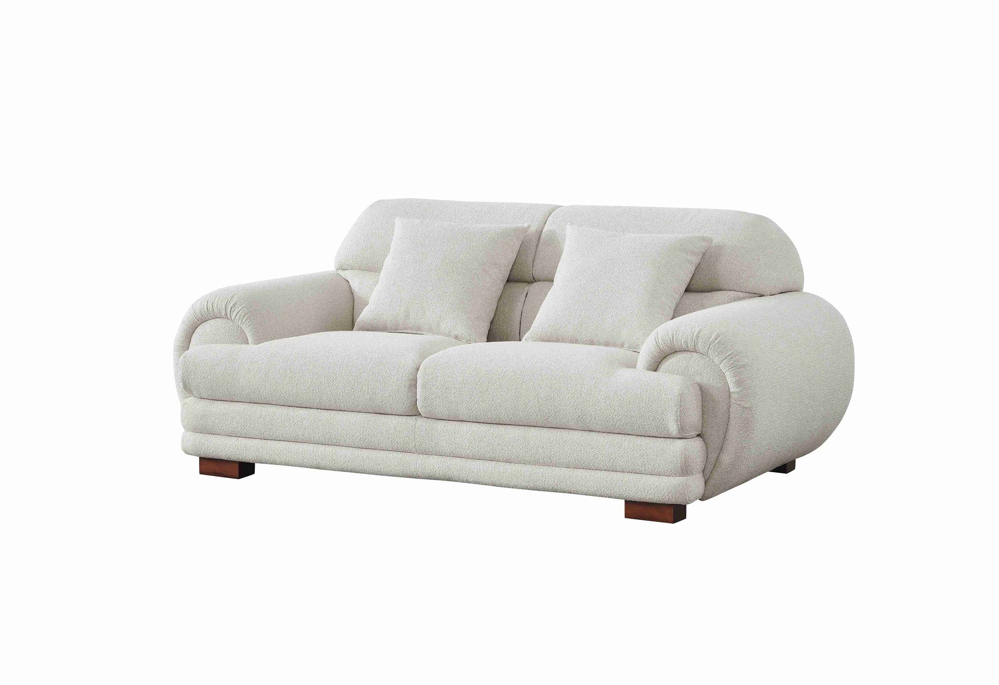Salon élégant avec canapé trois places, deux places et fauteuil aux formes arrondies