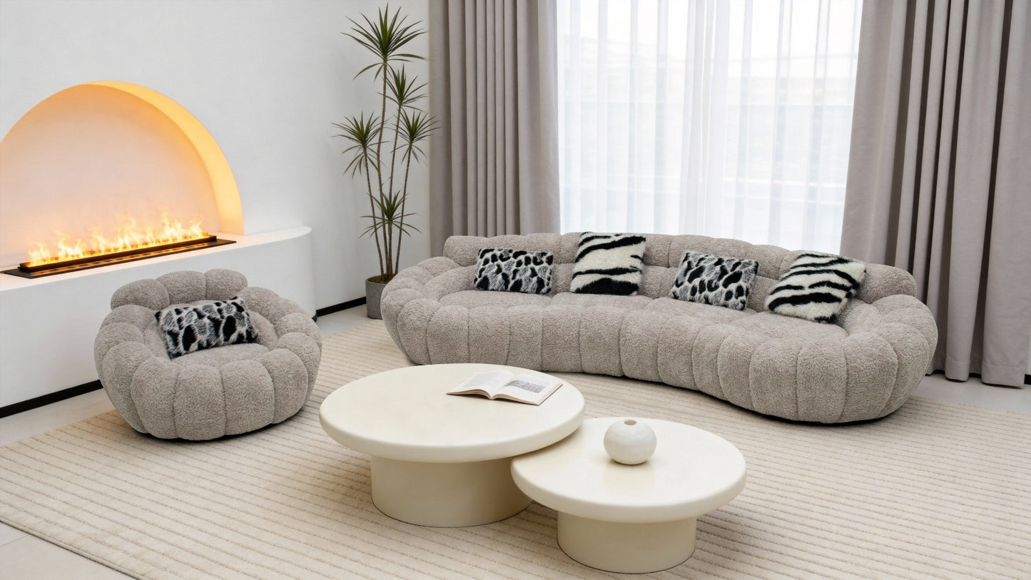 Canapé design organique en tissu bouclé beige avec formes arrondies et assise profonde pour salon moderne.