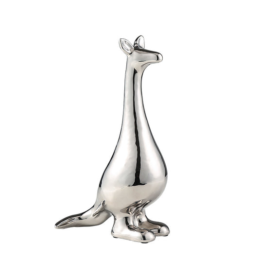 Sculpture décorative argentée moderne en forme d’animal stylisé pour salon et décoration intérieure élégante.